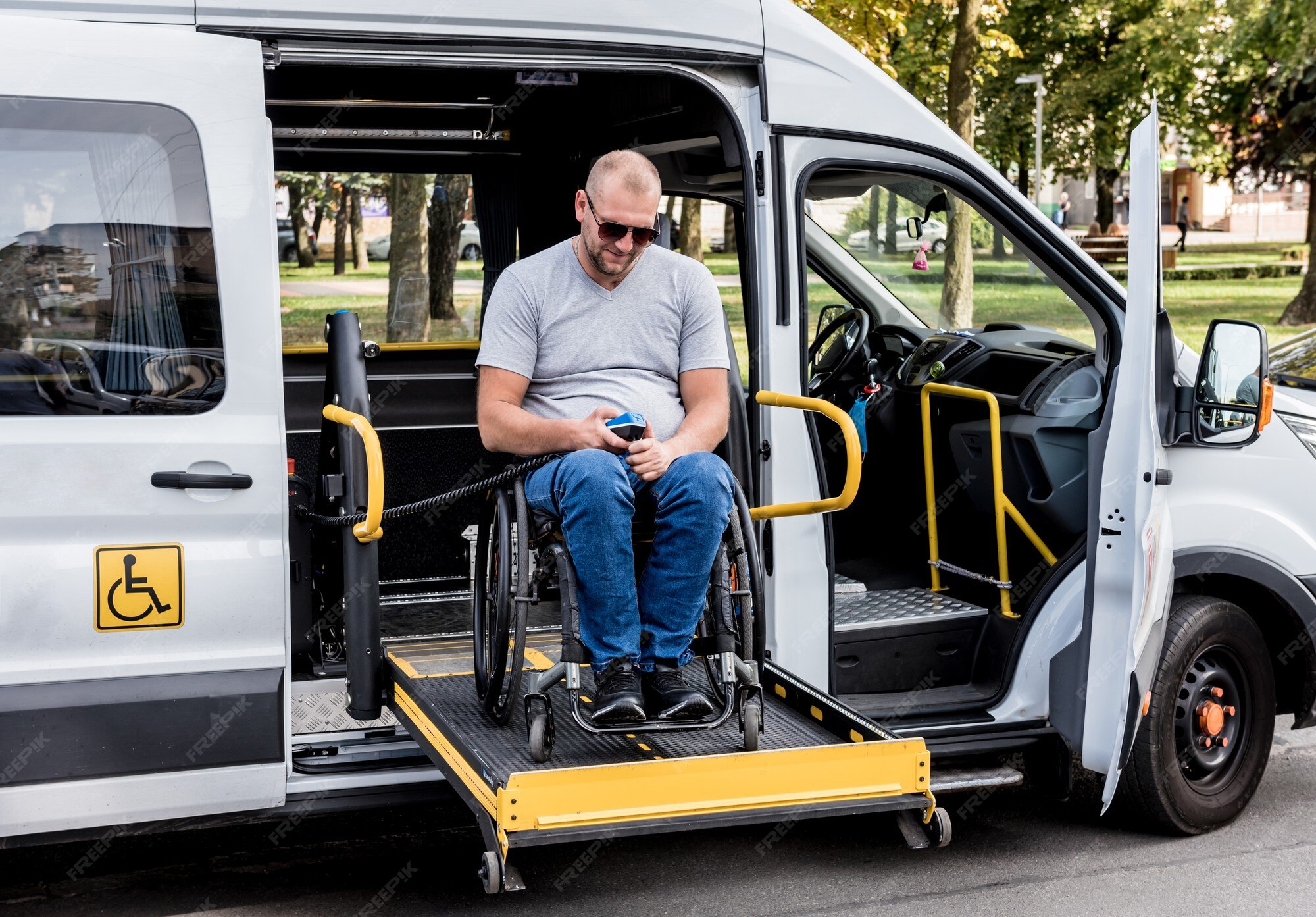 man-wheelchair-lift-vehicle-people-with-disabilities_179755-10354.jpg